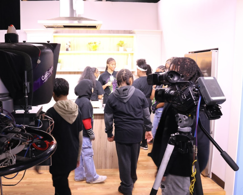 Students on cooking set chatting