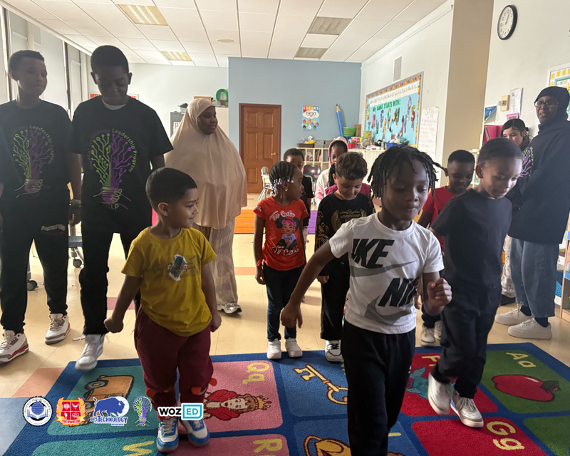 Students dancing on a rug