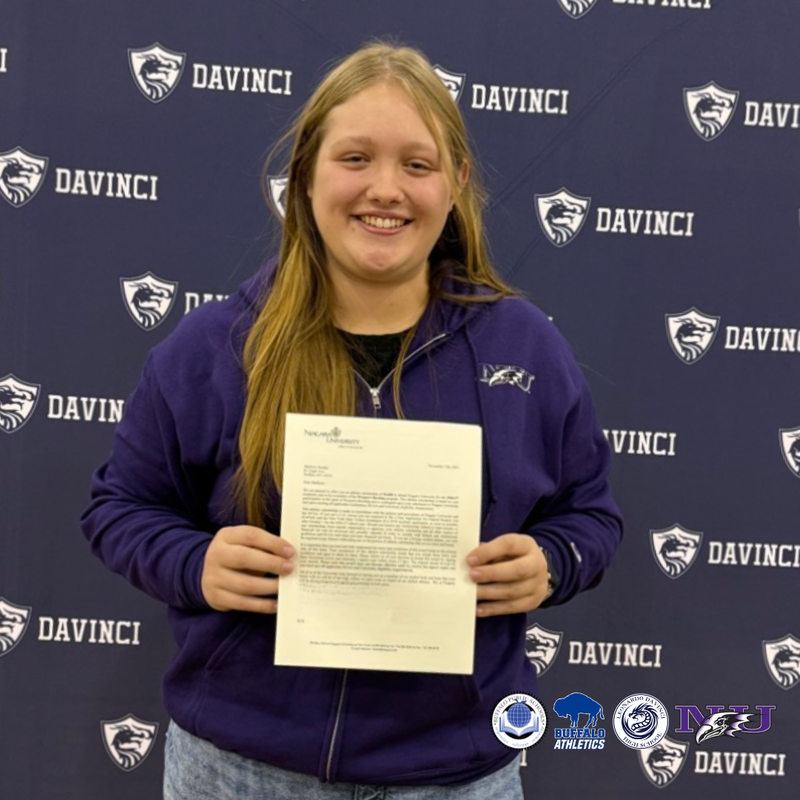 Girl Holding up up letter 