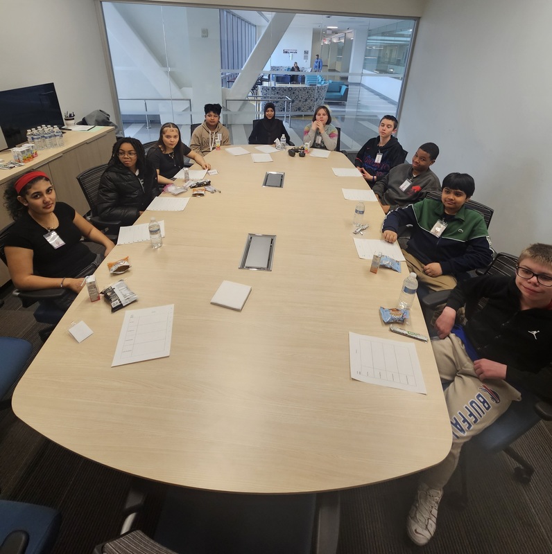 Students sitting at a conference table