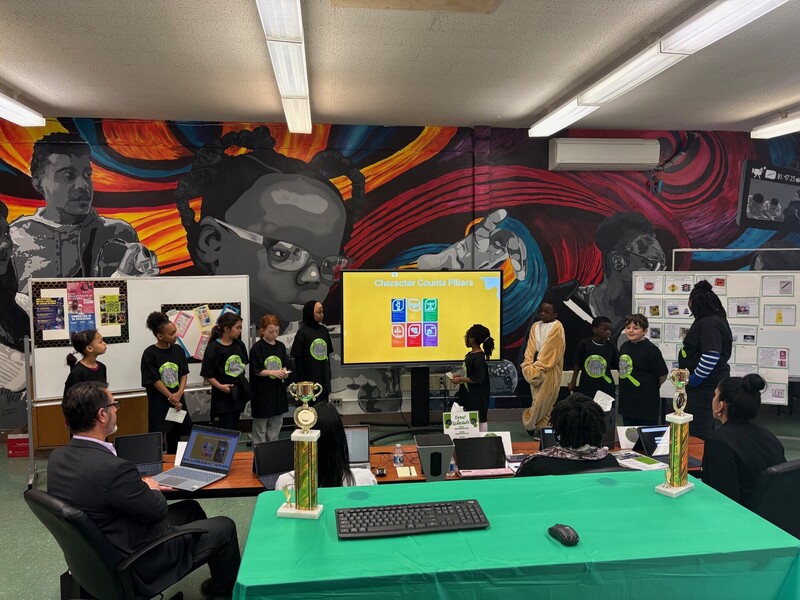 Students Presenting on a display monitor 