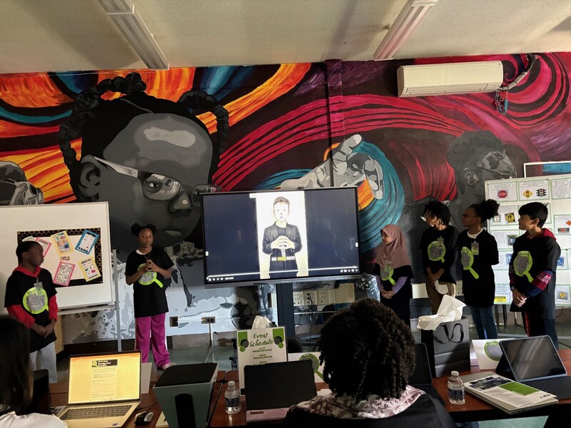 Students Presenting on a display monitor 