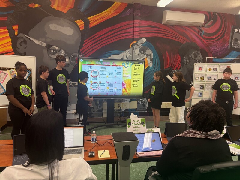 Students Presenting on a display monitor 
