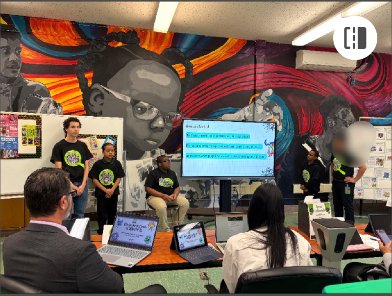 Students Presenting on a display monitor 