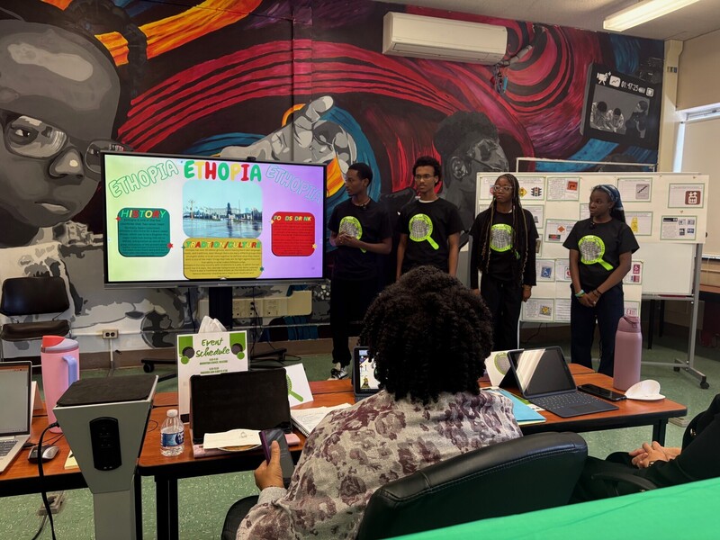 Students Presenting on a display monitor 