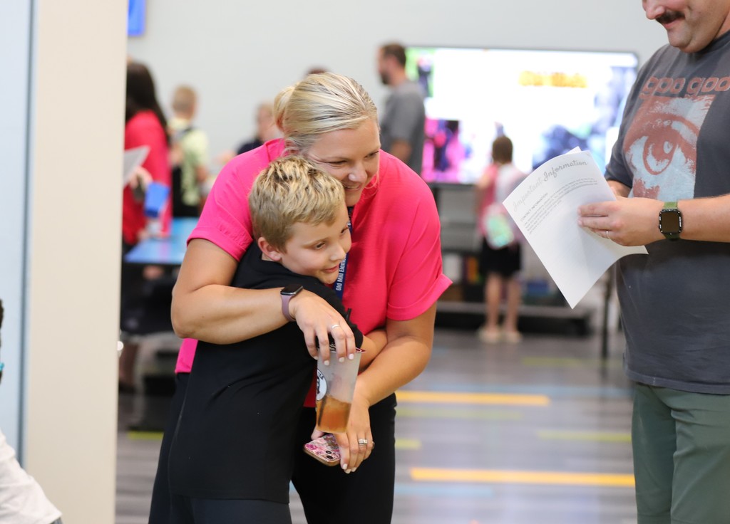 Staff Member Greeting Student