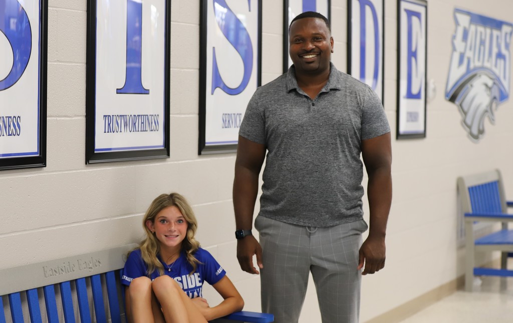 Student Smiling with Principal