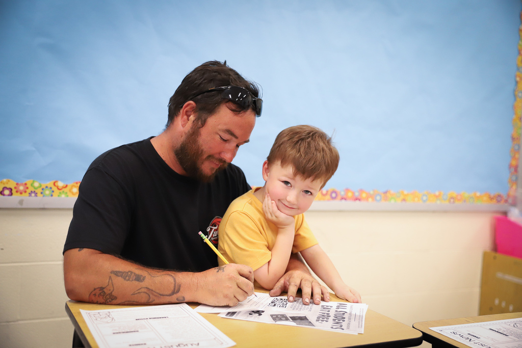 Father and Son completing paper work