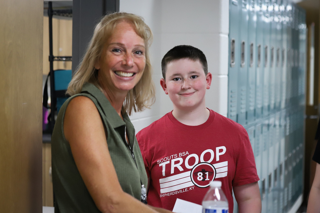 Student with Teacher Smiling