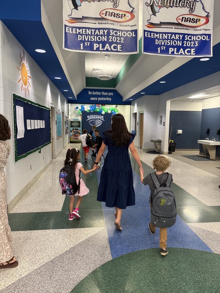 Staff walking students to class