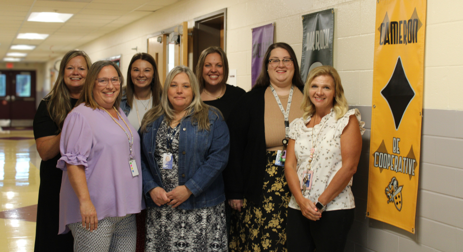Admin and Front office team smiling for a photo