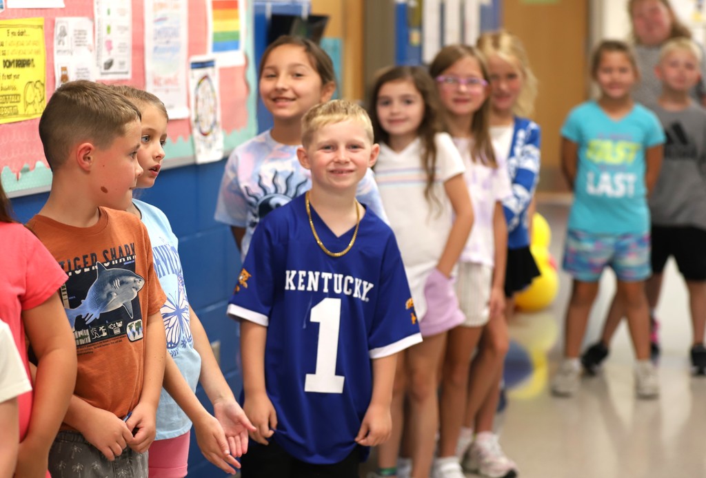 Smiling students in hallway