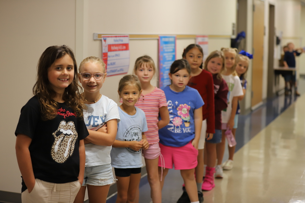 Students in hallway smiling