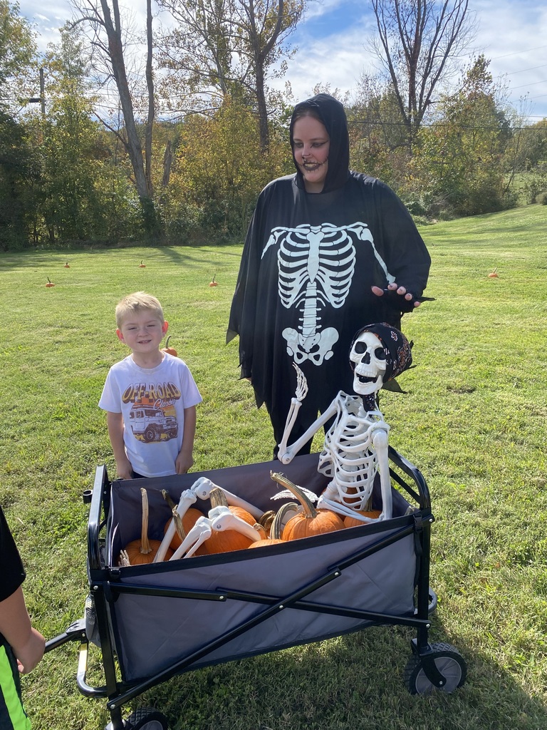 Owen and Ms. Sam with a skeleton