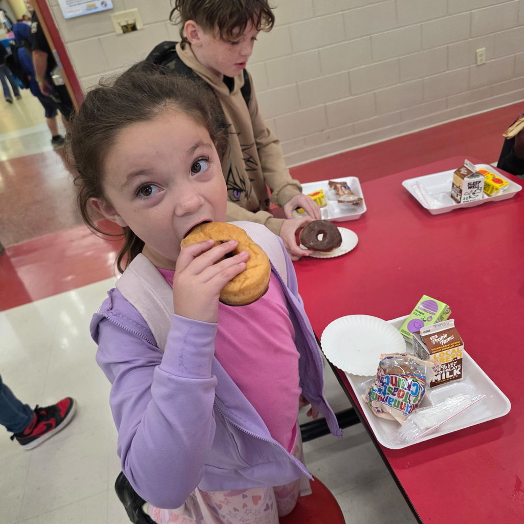 Kids with buddies and donuts