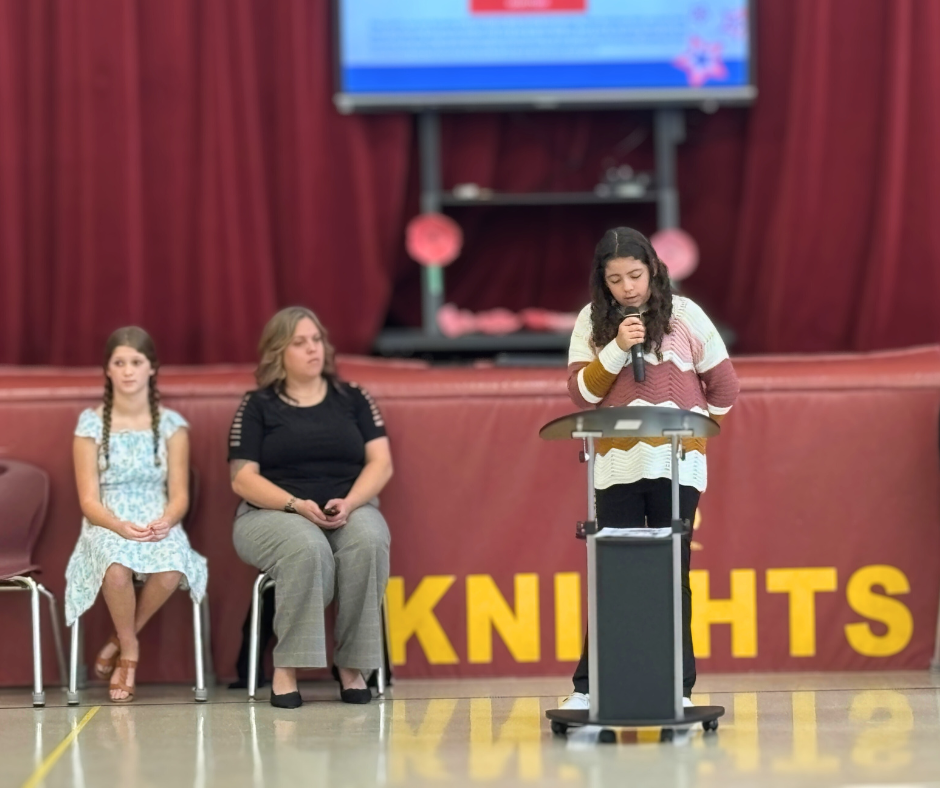 Skyler speaking at Veterans Day Assembly