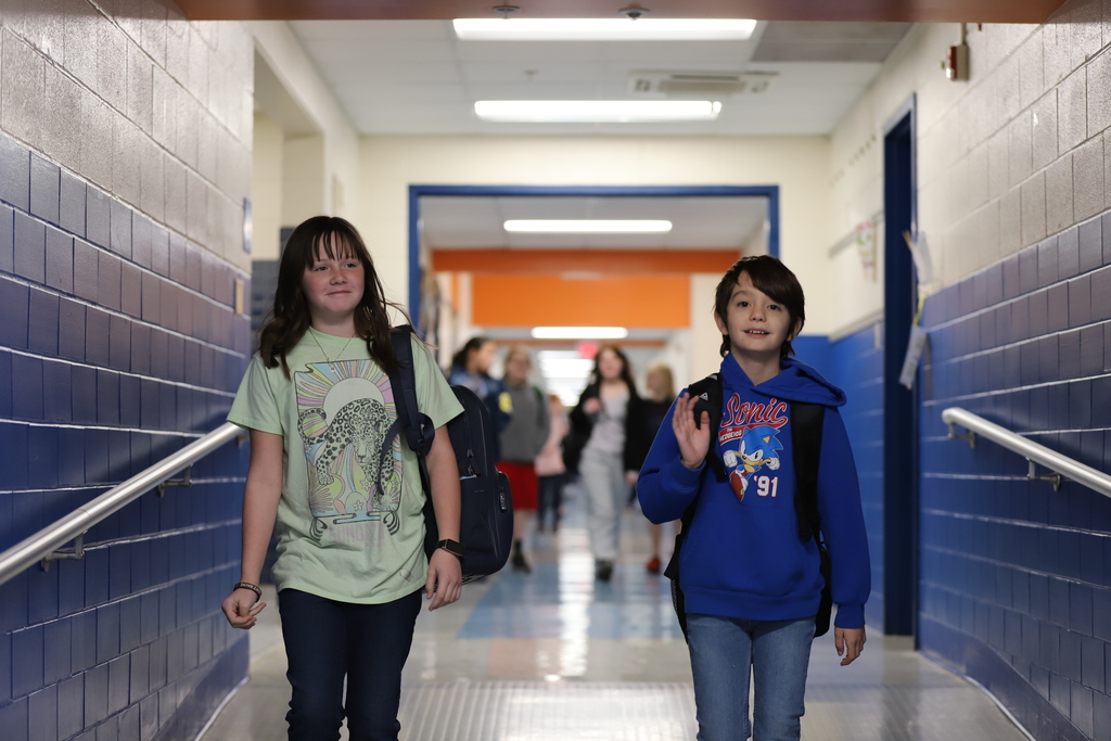 Student Walking in Hallway