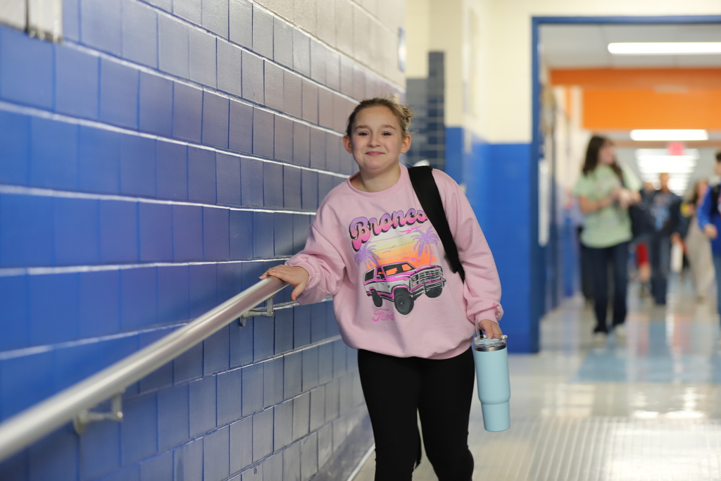 Student Walking in Hallway