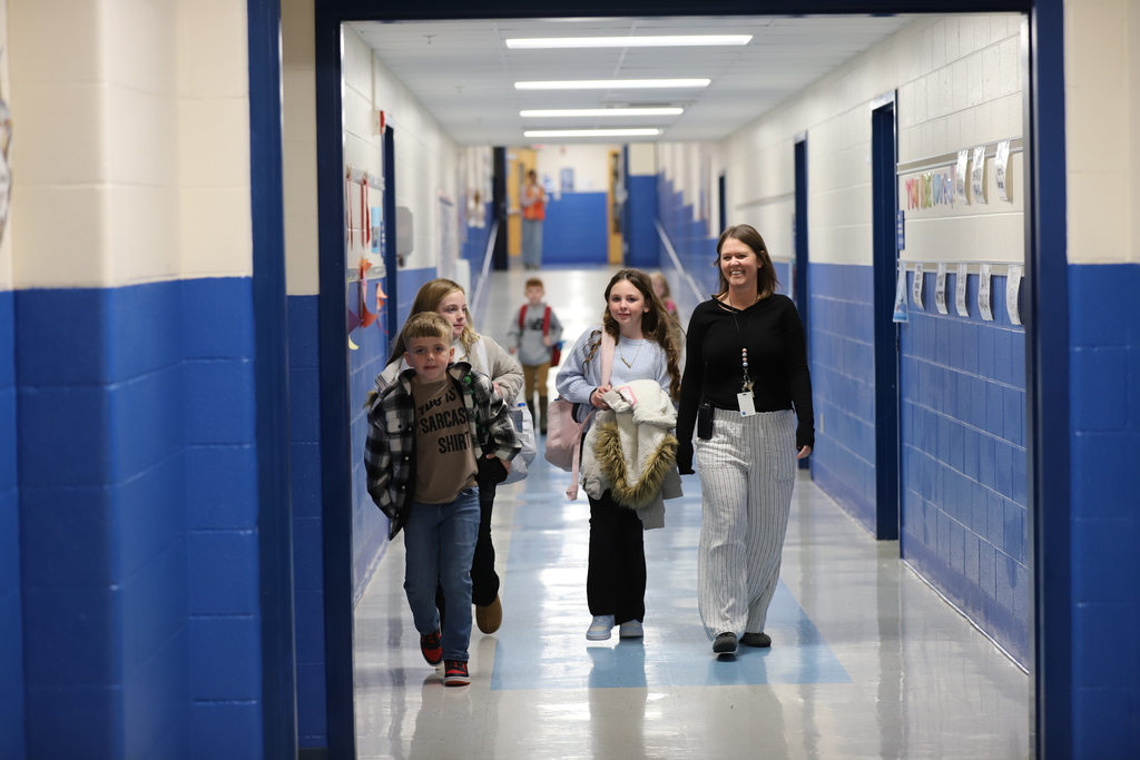 Students with Teacher in the Hallway