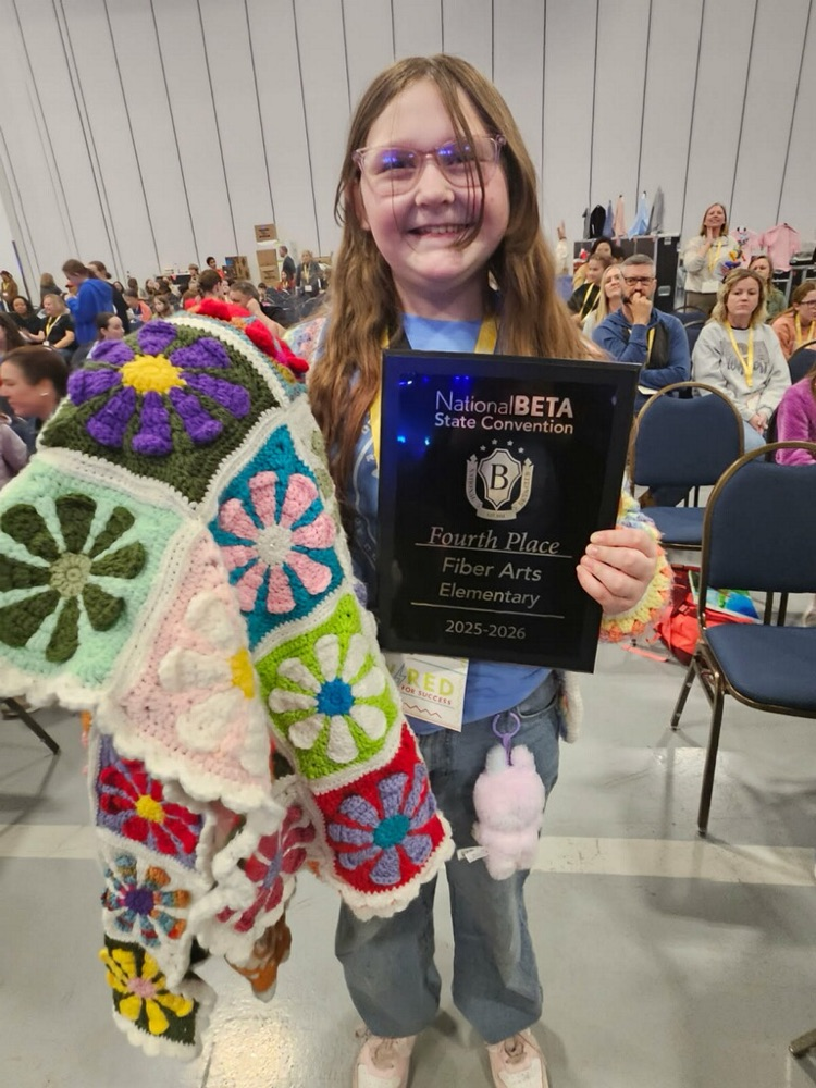 Aubrey and her fiber creation