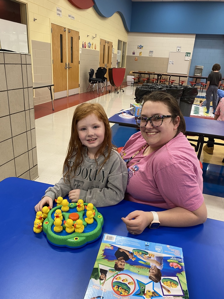 Playing Lucky ducks with her teacher