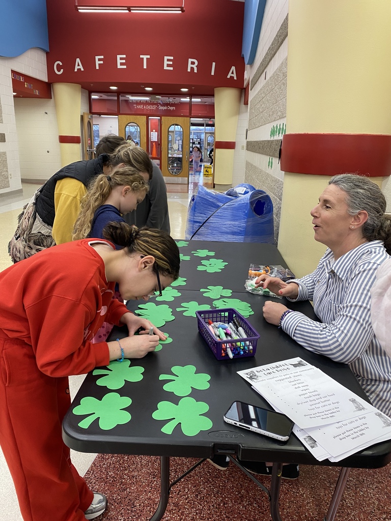Filling out shamrocks to show kindness