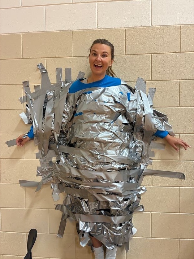Mrs. Luckett duct taped to a wall