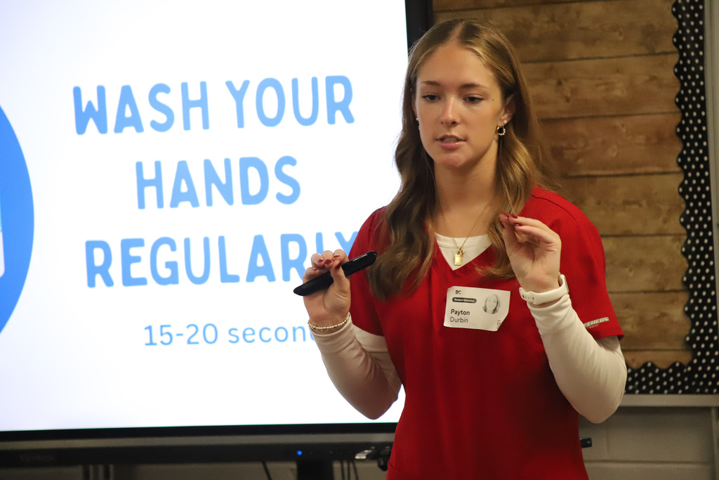 BEHS Health Science student present to elementary students about washing their hands correctly