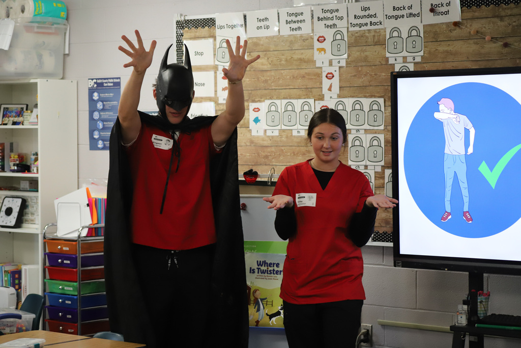BEHS Health Science student present to elementary students about washing their hands correctly