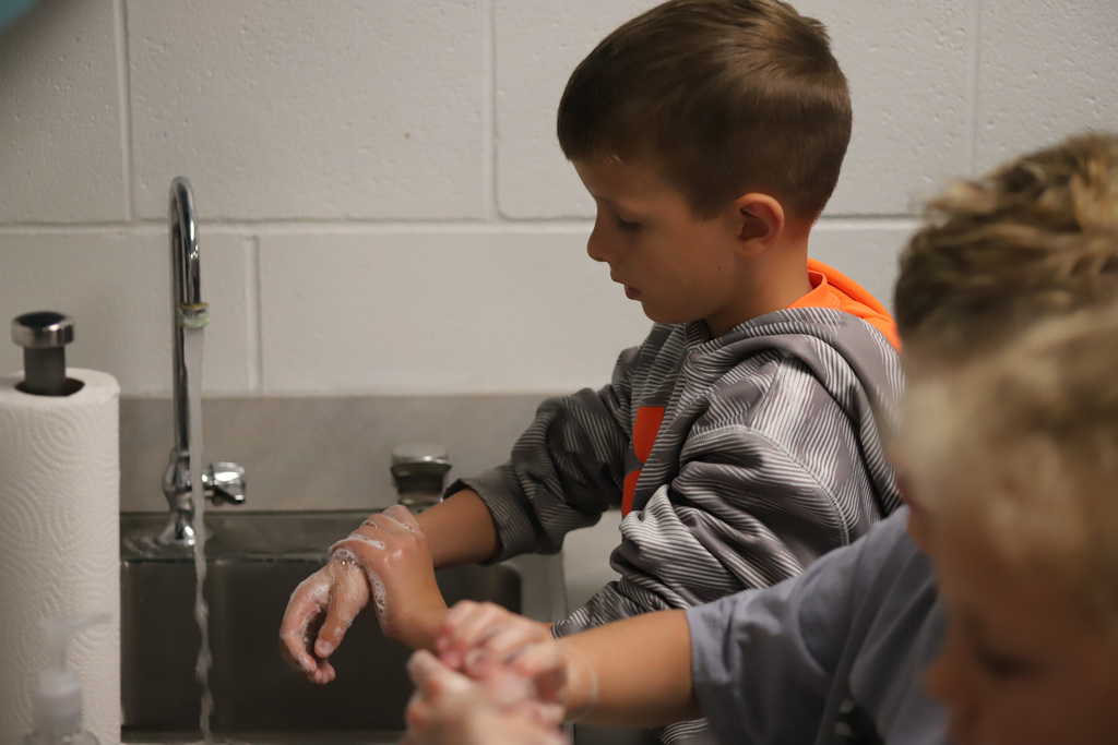 BEHS Health Science student present to elementary students about washing their hands correctly