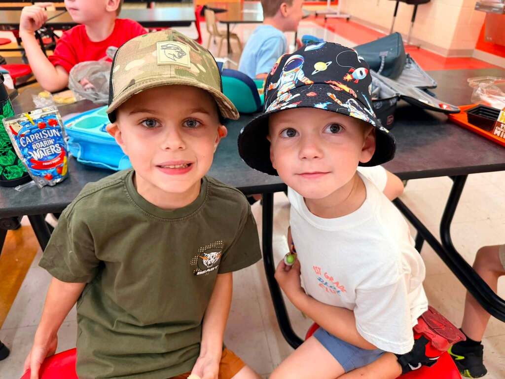 Childhood Cancer Awareness Week: Students at a lunch table with hats on 