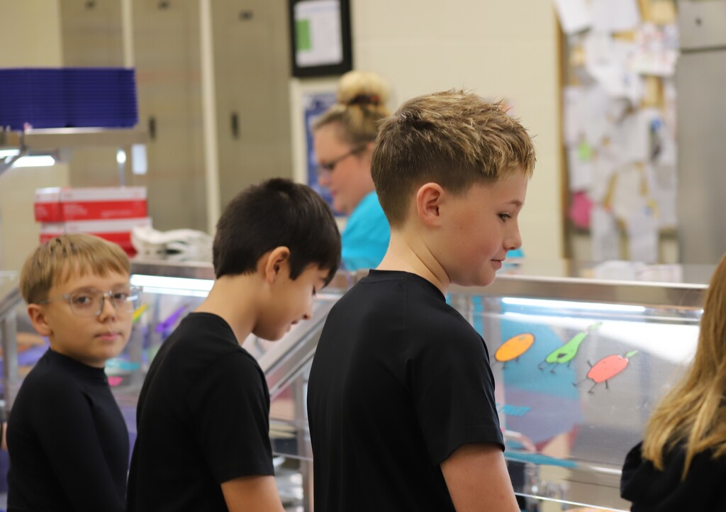 National school lunch week; students smiling and getting lunch in the lunch line