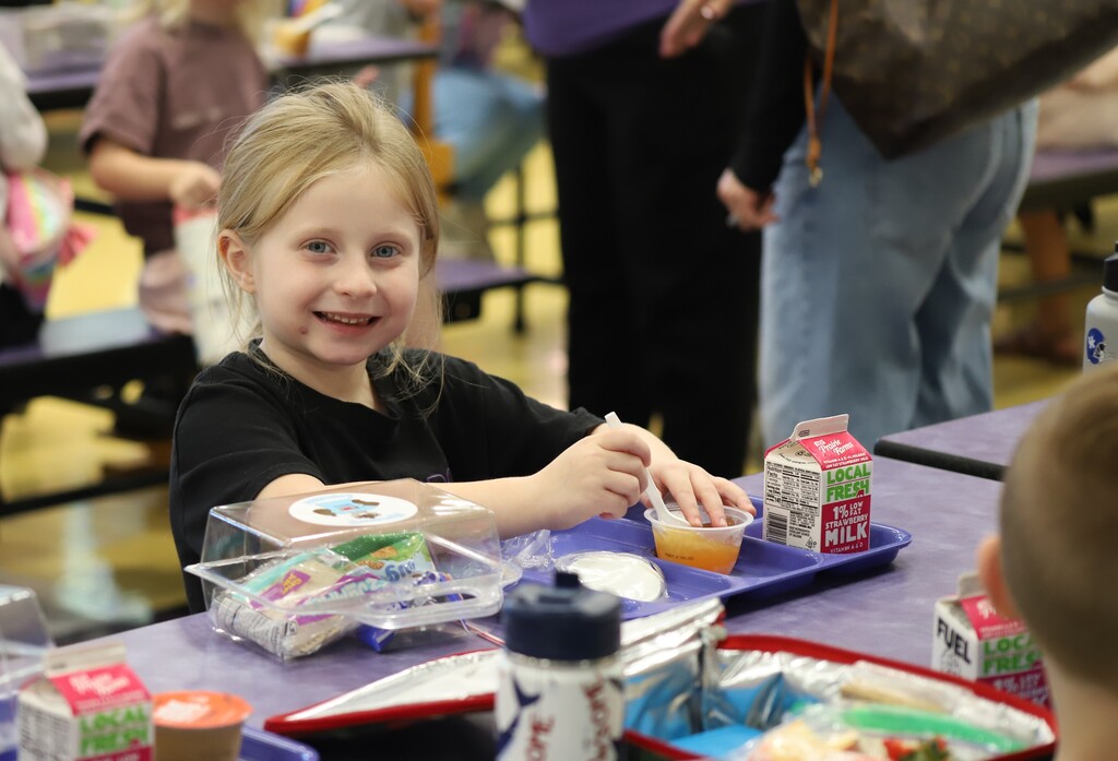 National school lunch week; students smiling and eating lunch