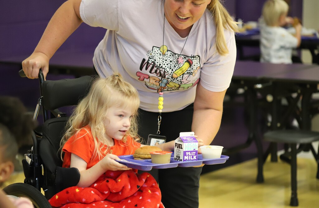 National school lunch week; students smiling and eating lunch