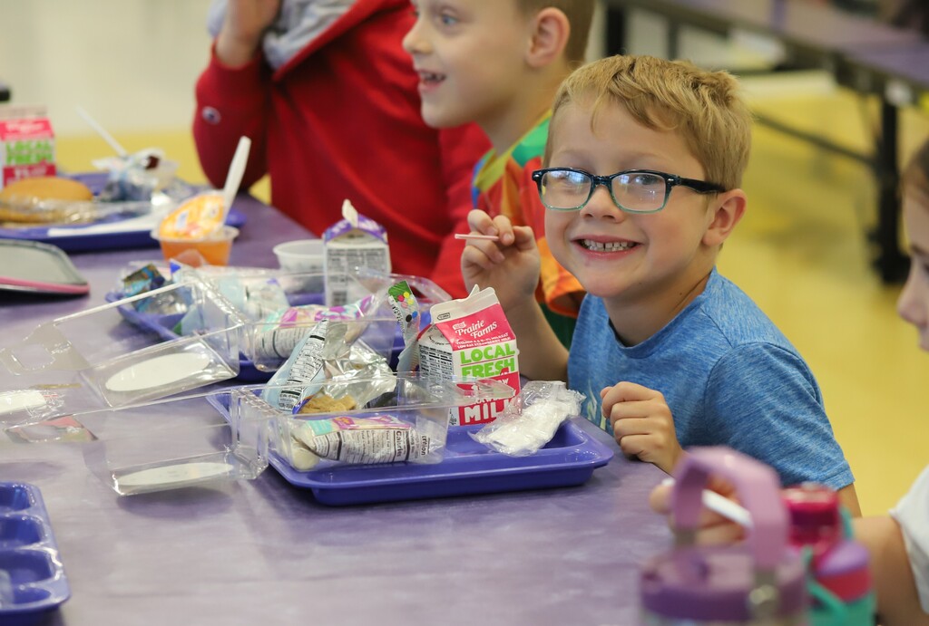 National school lunch week; students smiling and eating lunch