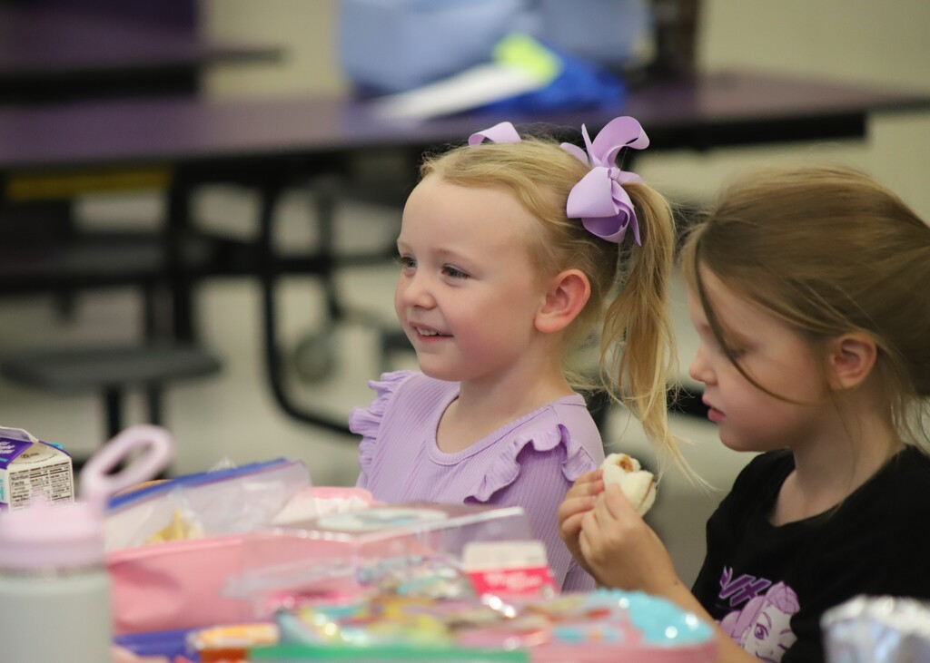 National school lunch week; students smiling and eating lunch