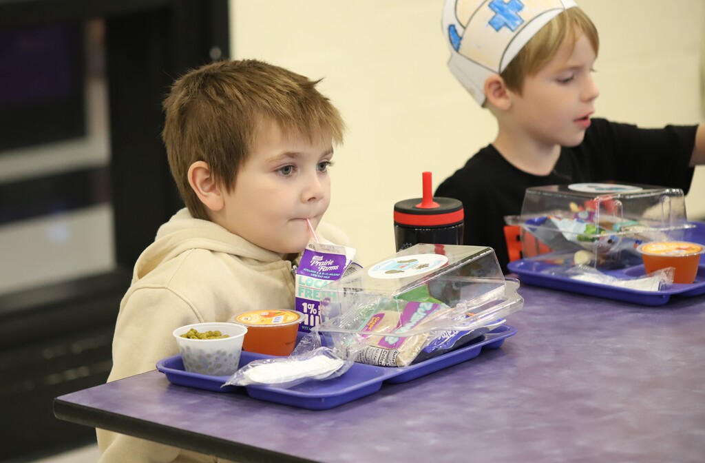 National school lunch week; students smiling and eating lunch