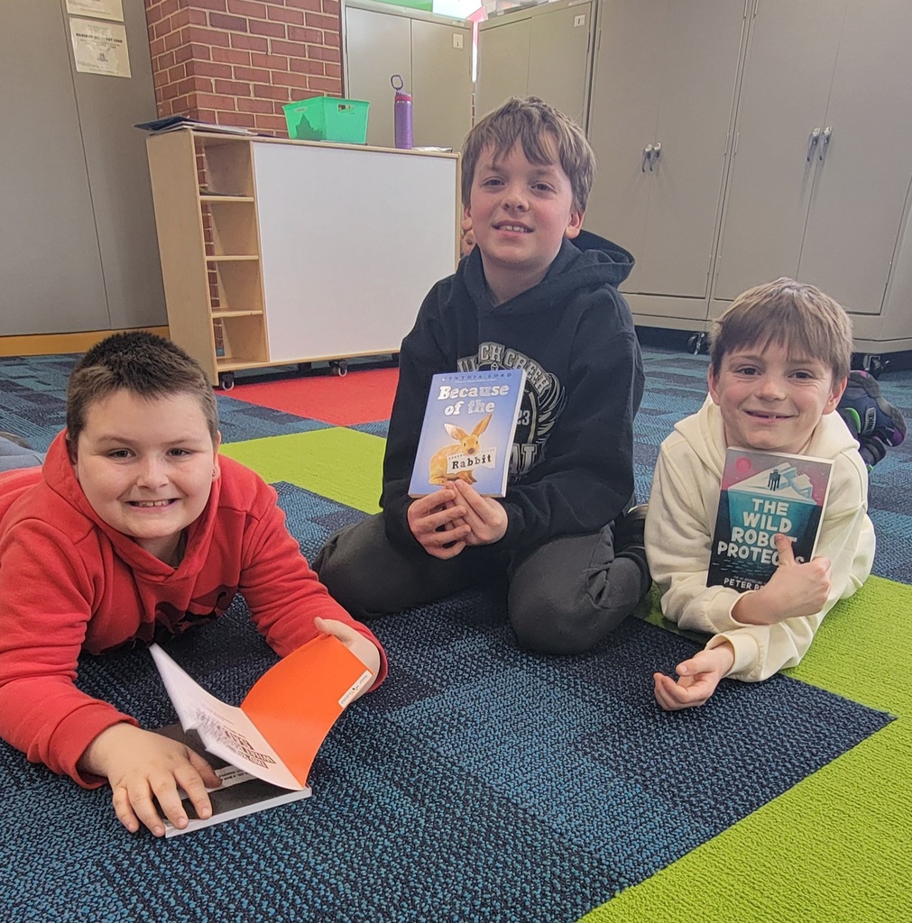 Students reading their book.
