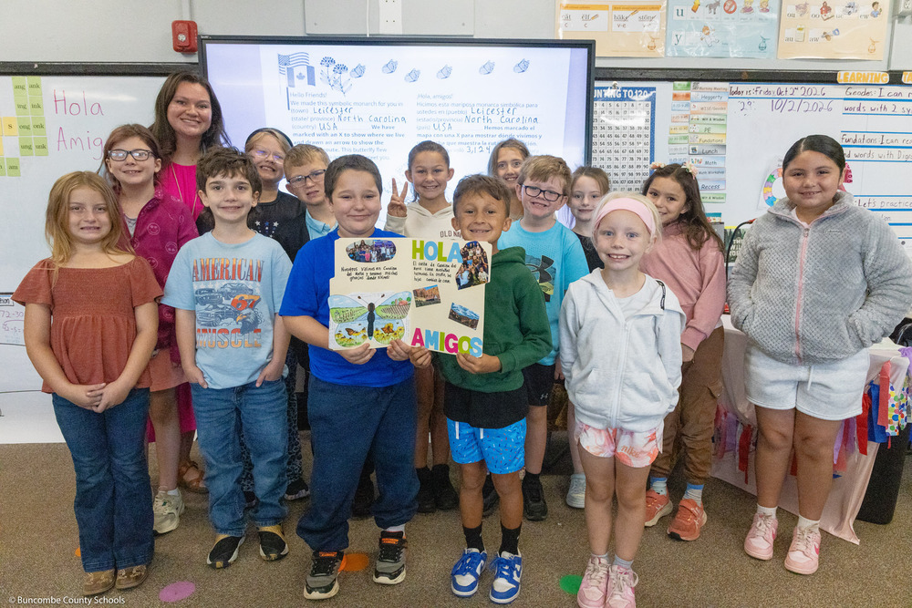 Sarah Gillespie’s class poses with a large decorated letter.