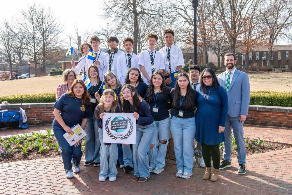 A.C. Reynolds Middle students pose for a photo on the campus of UNC-Greensboro