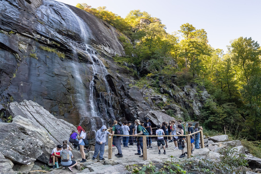A group of A.C. Reynolds Middle School seventh graders stand on the Hickory Nut Falls viewing platform.