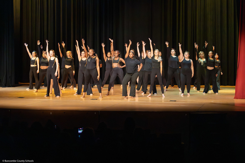 Erwin High dance students perform on stage.