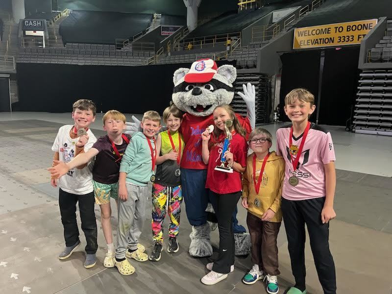 The Fairview Odyssey of the Mind team with a Raccoon Mascot. 