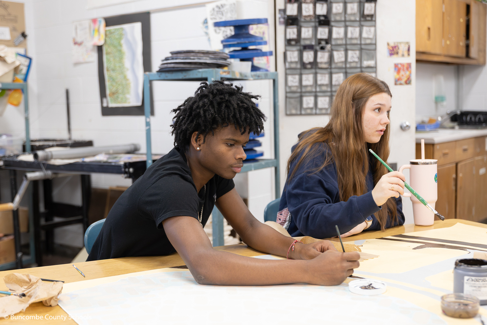 Student painting the art mural. 
