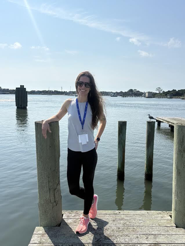 Katie Wilson standing on a dock. 