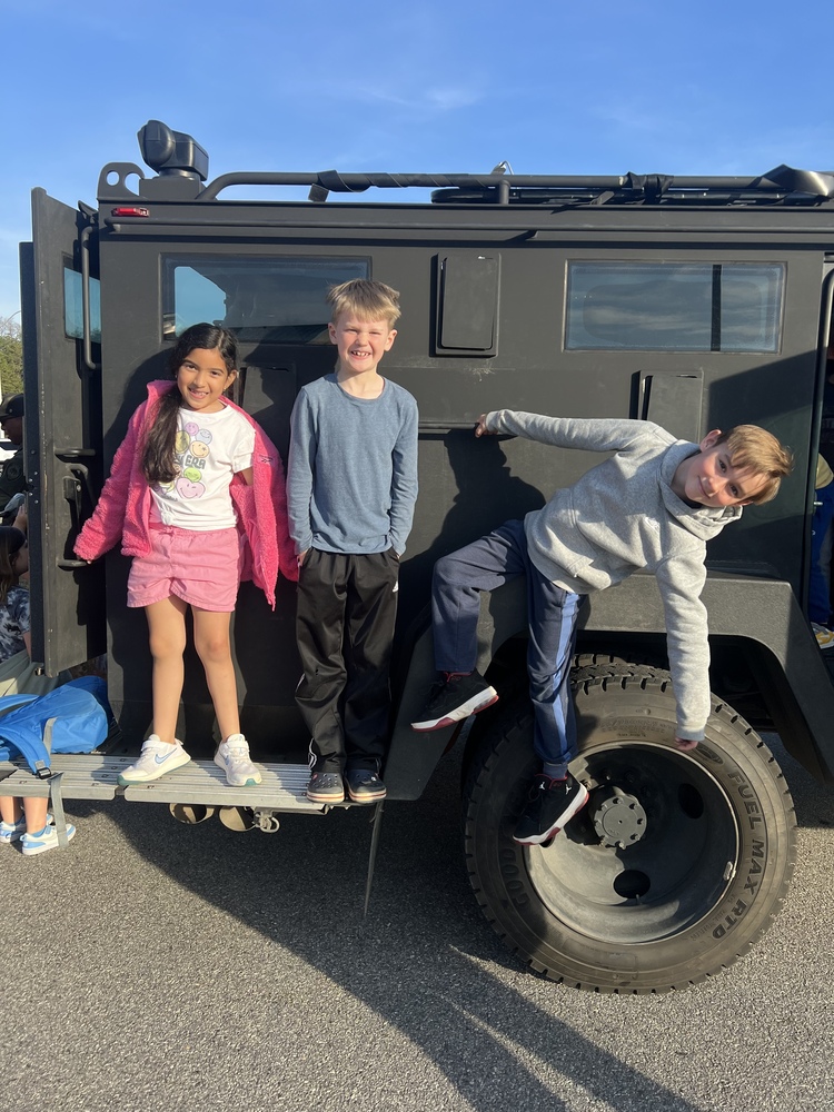 Students on the Bearcat car from the Buncombe County Sheriff's Department. 