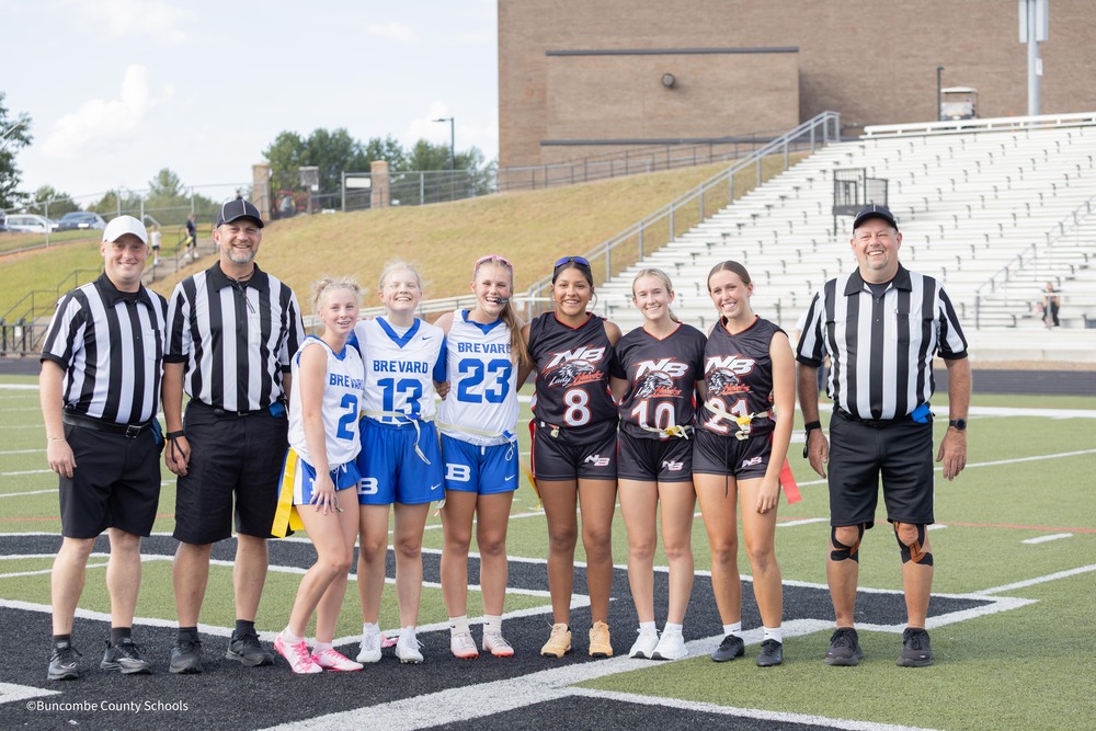 student athletes pose with refs