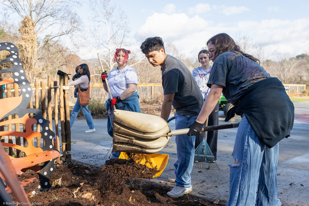 Students help clean up the grounds of WNC Nature Center.