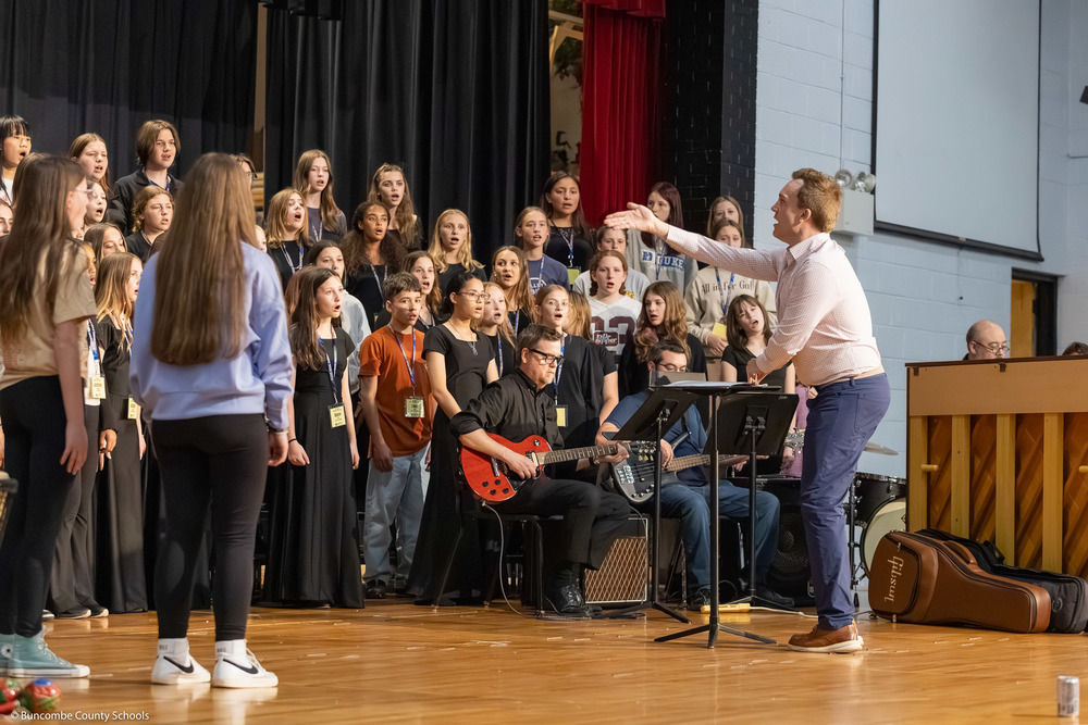 Middle School All-County Chorus members practice before the performance.