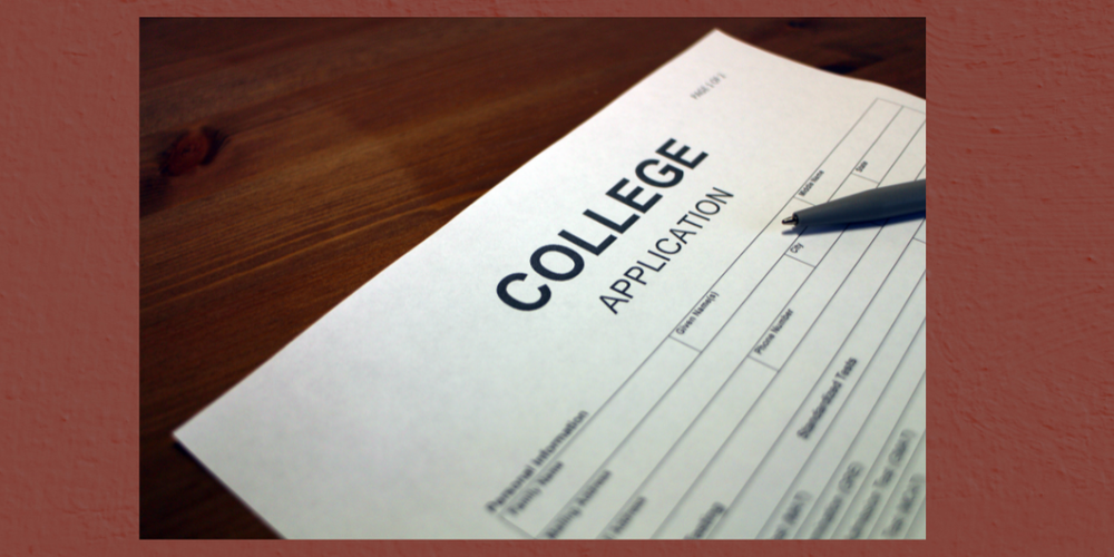 Image of College Application with pen resting on top of form